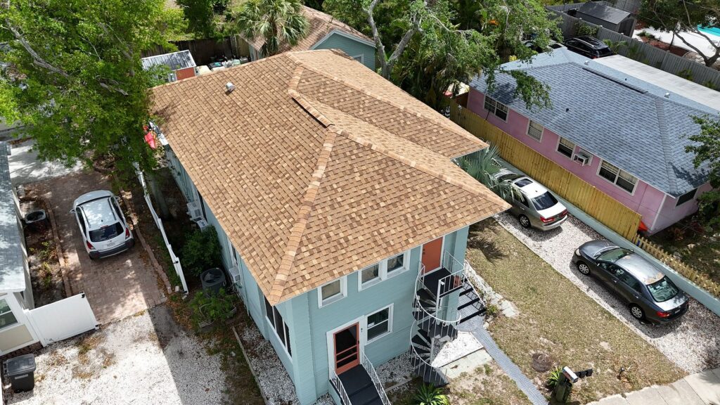 Tan shingle roof replacement on two-story home in St. Petersburg FL