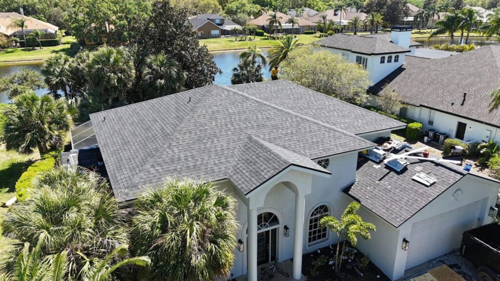 New dark gray shingle roof installation on two-story home in St. Petersburg FL